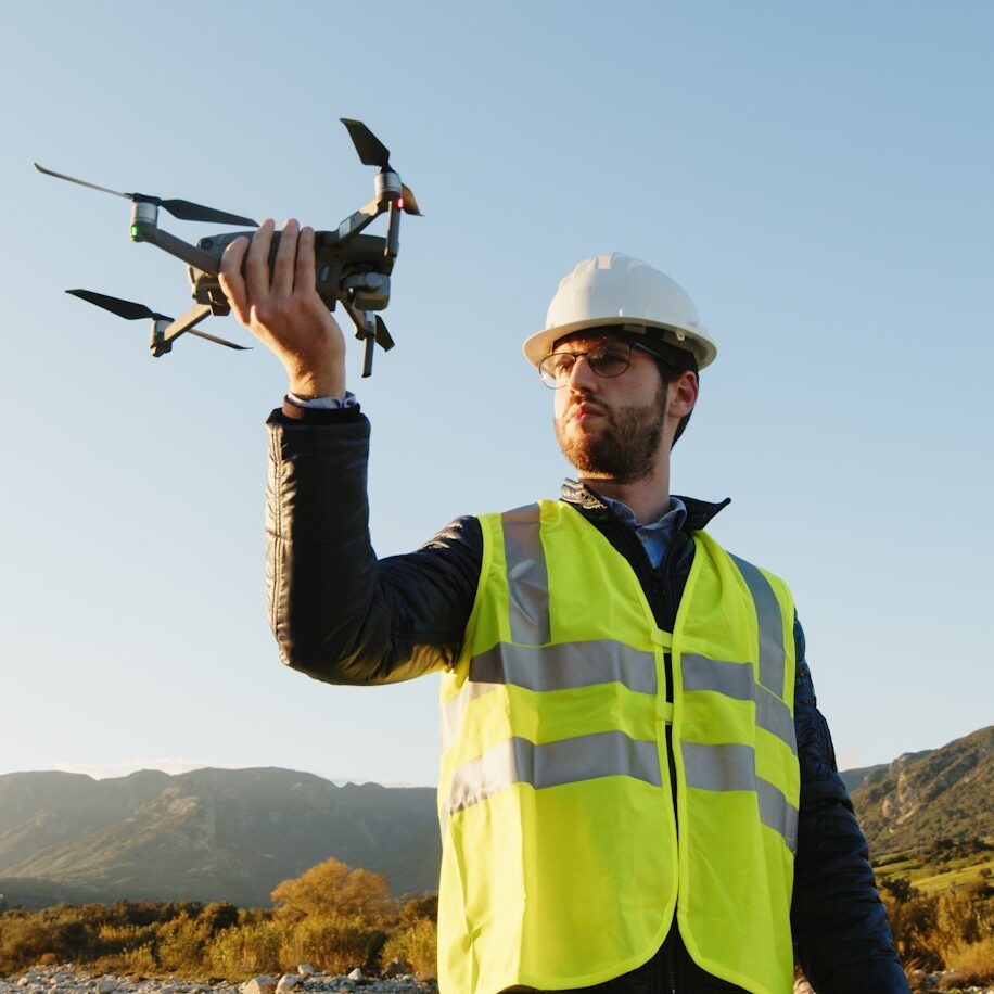 engineer with drone controls the territory